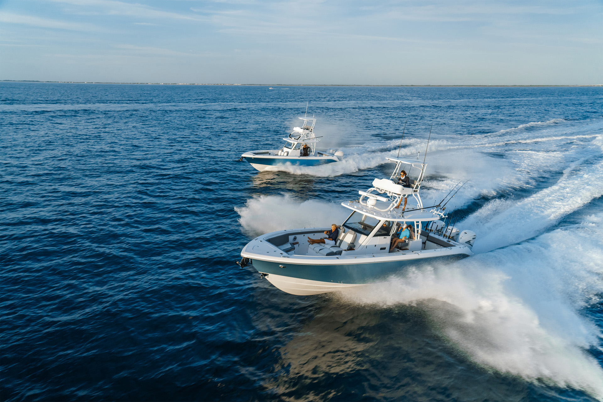 Two everglades boats driving in the ocean