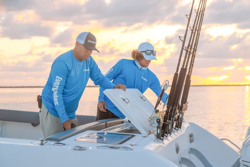 774 Two men looking at the fishing boat features on an everglades fishing boat