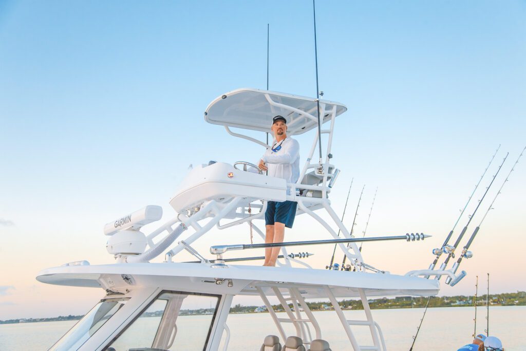 789 Man standing on upper deck of fishing boat