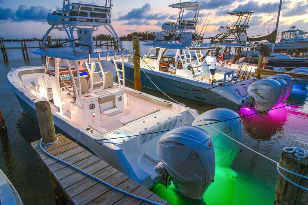 790 Everglades boats docked at the pier, illuminated by colorful fun lights
