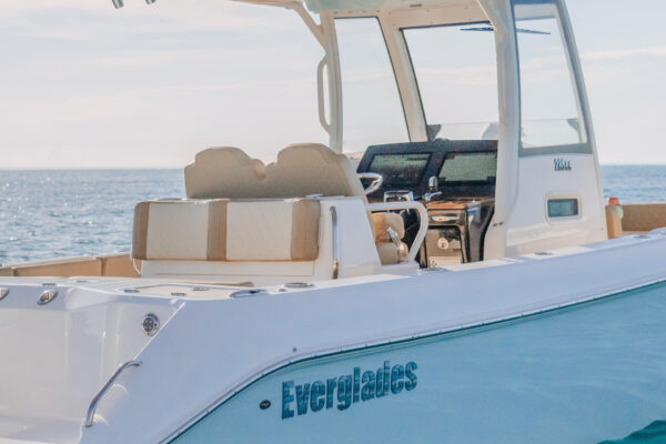 Everglades boat cockpit with creamy seats and clear blue sky over calm ocean