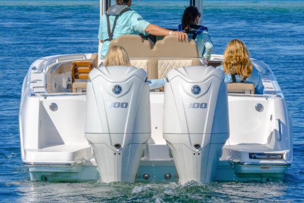 People riding in the center console everglades boat with two strong motors
