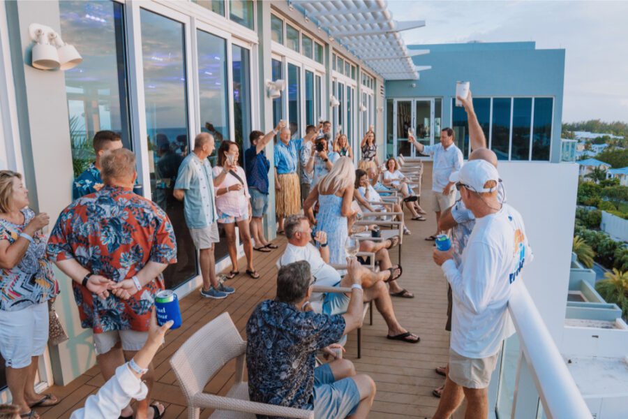 Group of people on a deck enjoying drinks