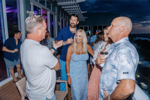 JJS07565_2877 Night party on a deck with people enjoying drinks
