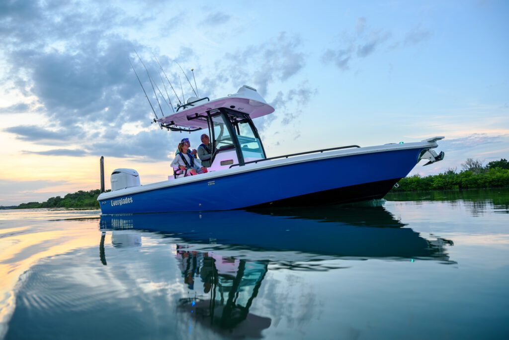 253-serene A person driving an Everglades boat through the water, surrounded by a scenic landscape