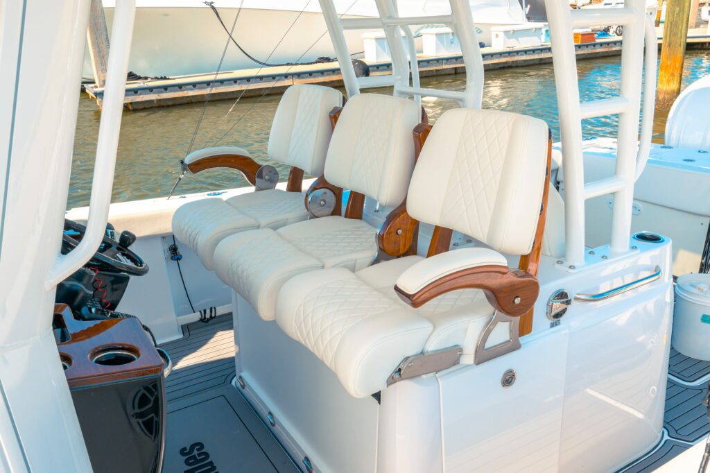 _Z9E4580 Cushioned bow seating with port and starboard removable teak ladderback backrests